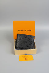 Louis Vuitton Monogram Embossed Bifold Wallet — Black