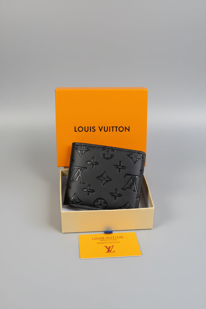 Louis Vuitton Monogram Embossed Bifold Wallet — Black